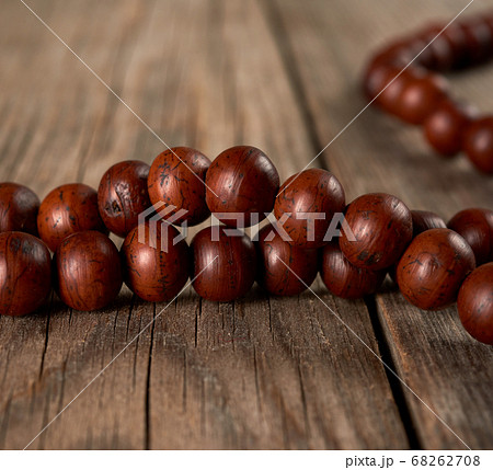 brown wooden prayer rosary on a wooden table brown wooden prayer rosary on a wooden table 68262708
