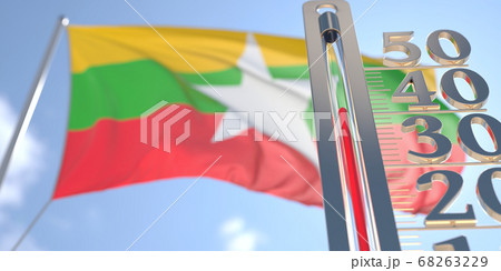 Thermometer shows high air temperature against blurred flag of Myanmar. Hot weather forecast related 3D rendering 68263229