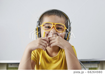 Portrait of thoughtful schoolboy having a big idea Portrait of thoughtful schoolboy having a big idea 68264980