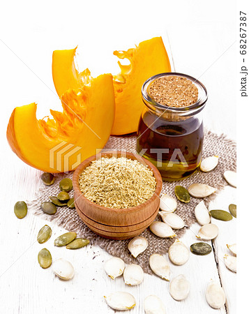 Flour pumpkin in bowl on wooden board 68267387