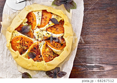 Galeta with tomato and cheese on dark board top Galeta with tomato and cheese on dark board top 68267512