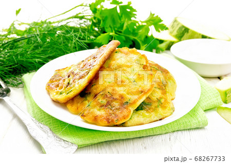 Pancakes of zucchini on towel 68267733