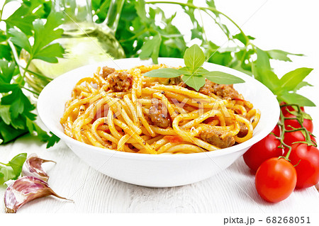 Spaghetti with bolognese in plate on wooden board Spaghetti with bolognese in plate on wooden board 68268051