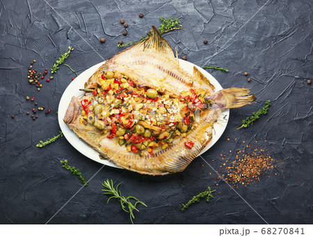 Flounder with vegetables on table 68270841