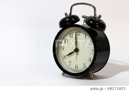 Twin bell alarm clock black color on eight o'clock. 68271825