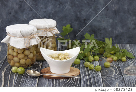 Homemade pickled gooseberries with spices in glass Homemade pickled gooseberries with spices in glass 68275423