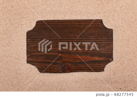 Wooden board with place for text on the sand. Top view Wooden board with place for text on the sand. Top view 68277545