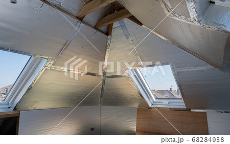 Unfinished residential loft conversion with silver insulation Unfinished residential loft conversion with silver insulation 68284938