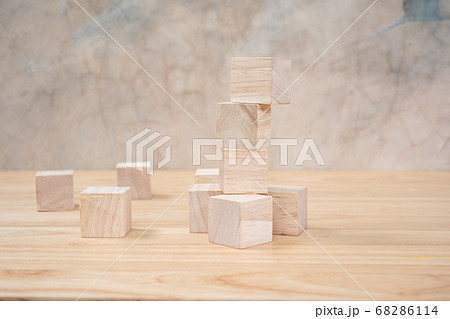 Wooden toy cubes on wooden table ang grey Wooden toy cubes on wooden table ang grey 68286114