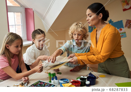 Happy children during art course in class room Happy children during art course in class room 68287833