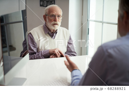 Elderly patient showing up for a doctors appointment 68288921