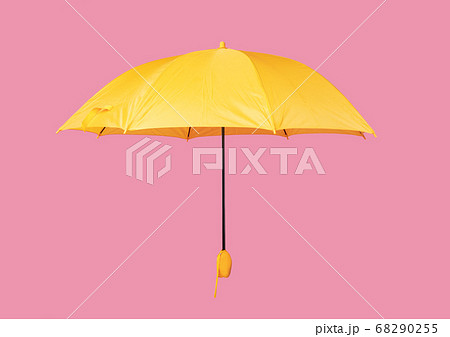 Opened yellow umbrella isolated on pink background 68290255