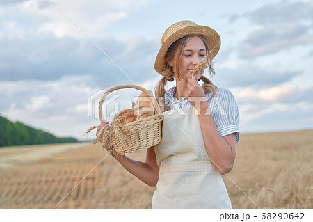 Female farmer standing wheat agricultural field 68290642
