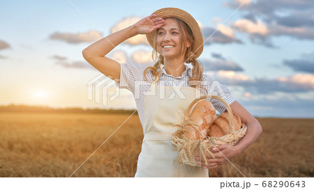 Female farmer standing wheat agricultural field 68290643