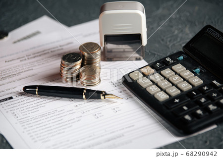 Saving stack coins money concept,graph,chart document and pen on desktop desk in hipster office,copy space.selective focus,vintage color 68290942