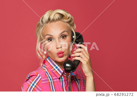 Happy pinup woman phone. Beautiful retro model 68291272