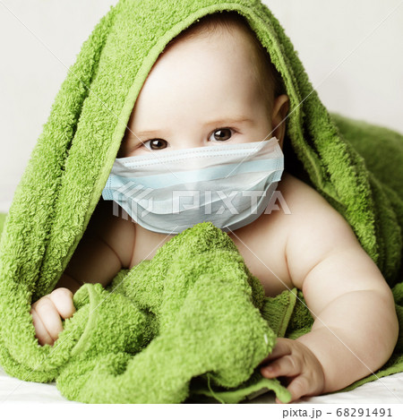 Cute little baby in medical protective face mask Cute little baby in medical protective face mask 68291491