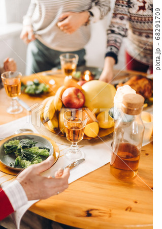 people standing near the table with food people standing near the table with food 68291709