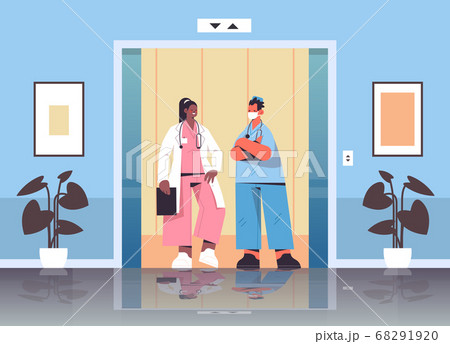 mix race medical workers discussing during meeting in hospital elevator healthcare medicine concept mix race medical workers discussing during meeting in hospital elevator healthcare medicine concept 68291920