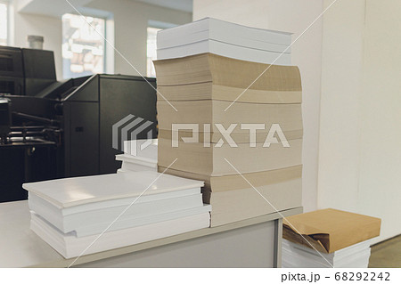 stacks of printed sheets of cardboard on wooden pallets closeup. printing industry. stacks of printed sheets of cardboard on wooden pallets closeup. printing industry. 68292242