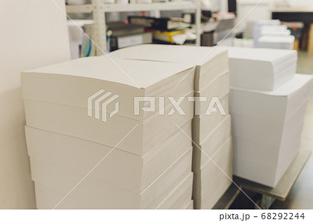 stacks of printed sheets of cardboard on wooden pallets closeup. printing industry. stacks of printed sheets of cardboard on wooden pallets closeup. printing industry. 68292244