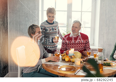 happy family is drinking juice during the party happy family is drinking juice during the party 68292245