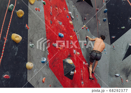 skilled climber enjoying the time at climbing classes skilled climber enjoying the time at climbing classes 68292377