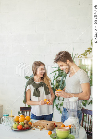 awesome young people are having fun while peeling fruits 68294796