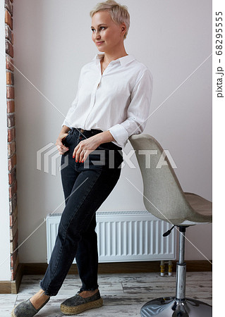 side view on blonde female with short haircut looking away side view on blonde female with short haircut looking away 68295555