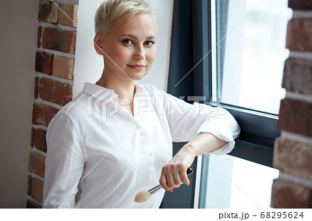 portrait of beautiful short-haired visagiste at work place portrait of beautiful short-haired visagiste at work place 68295624