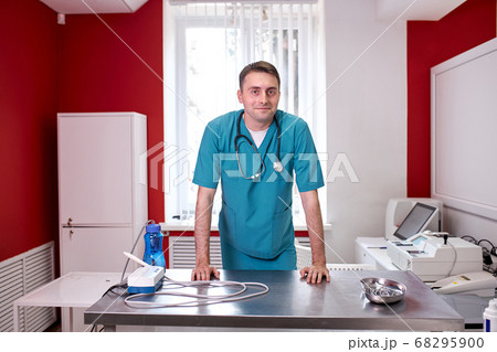caucasian veterinarian in his cabinet 68295900