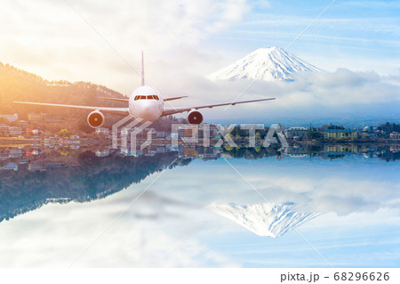 Airplane frying over the Snow Mountain Fuji 68296626