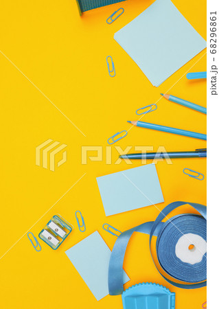 Minimalism, Back to school concept, blue school supplies on yellow background, flat lay copy space 68296861