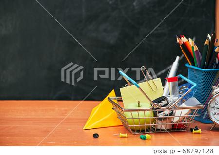 school still life, alarm clock, stand for pencils on the background of a school board, university, college 68297128