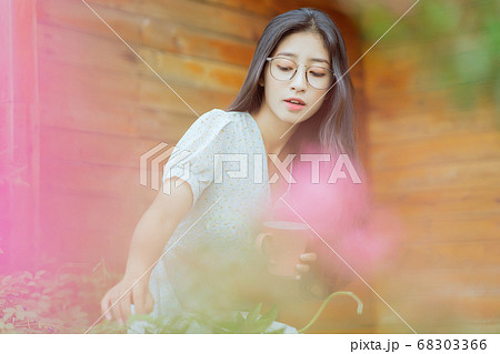 woman enjoying a cup of coffee in the morning 68303366