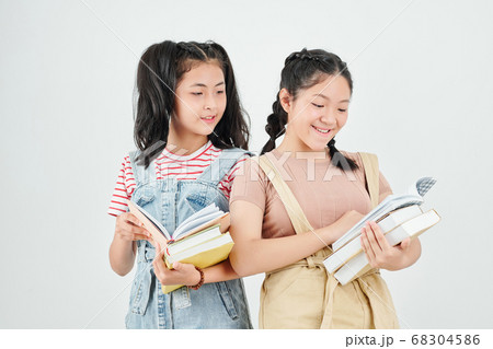 Schoolgirls reading students books 68304586