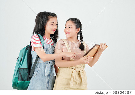 Teenage girls with digital tablet 68304587