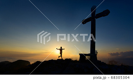 Mountain runner comes to the top where there is a Mountain runner comes to the top where there is a 68305304