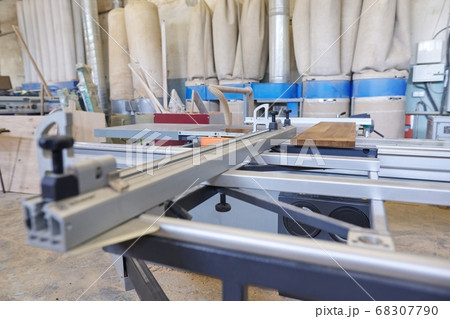 Background carpentry woodworking woodshop, machines and tools, wooden boards 68307790