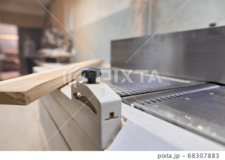 Background carpentry woodworking woodshop, machines and tools, wooden boards 68307883