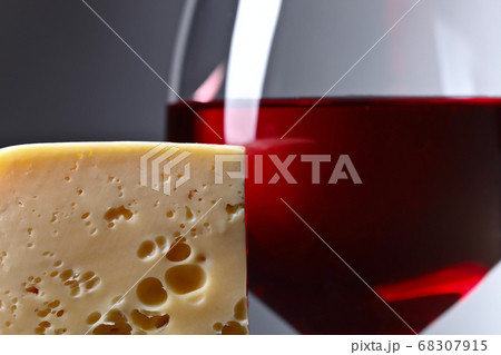 Cheese and glass of red wine 68307915