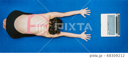 Banner Asian woman practicing yoga from home with laptop when Covid19 outbreak, healthy or Meditation Exercise, workout at home, coronavirus pandemic and quarantine, sports and healthcare in concept Banner Asian woman practicing yoga from home with laptop when Covid19 outbreak, healthy or Meditation Exercise, workout at home, coronavirus pandemic and quarantine, sports and healthcare in concept 68309212