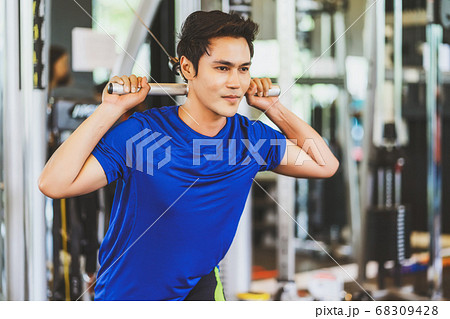 Young Asian man wearing sportswear doing excecise with the bar in gym fitness sport complex, posture position, sport club community, sports and healthcare concept, Young Asian man wearing sportswear doing excecise with the bar in gym fitness sport complex, posture position, sport club community, sports and healthcare concept, 68309428