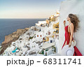 Europe Greece Santorini travel vacation woman on famous santorini Oia island travel destination. Happy young tourist woman. Summer wanderlust. 68311741