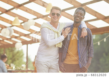 Friends Posing at Outdoor Summer Party in Sunlight Friends Posing at Outdoor Summer Party in Sunlight 68312020