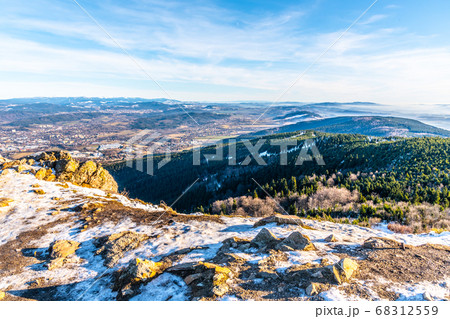 Scenic view of Liberec and surrounding mountains on sunny winter day. Lookout from Jested Mountain, Czech Republic Scenic view of Liberec and surrounding mountains on sunny winter day. Lookout from Jested Mountain, Czech Republic 68312559