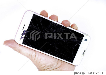 Hand hold the white smartphone with broken screen. 68312591