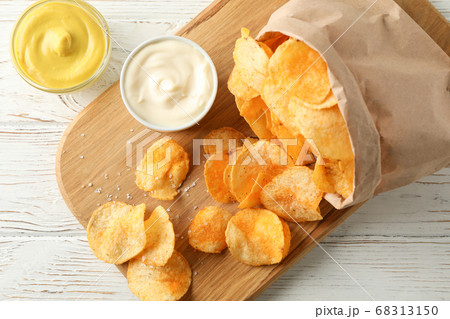 Paper bag of potato chips. Beer snacks, sauce on Paper bag of potato chips. Beer snacks, sauce on 68313150