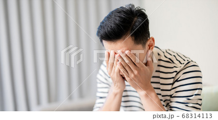 Asian man feel depressed 68314113