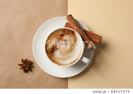 Cappuccino and cinnamon sticks on two tone 68315379